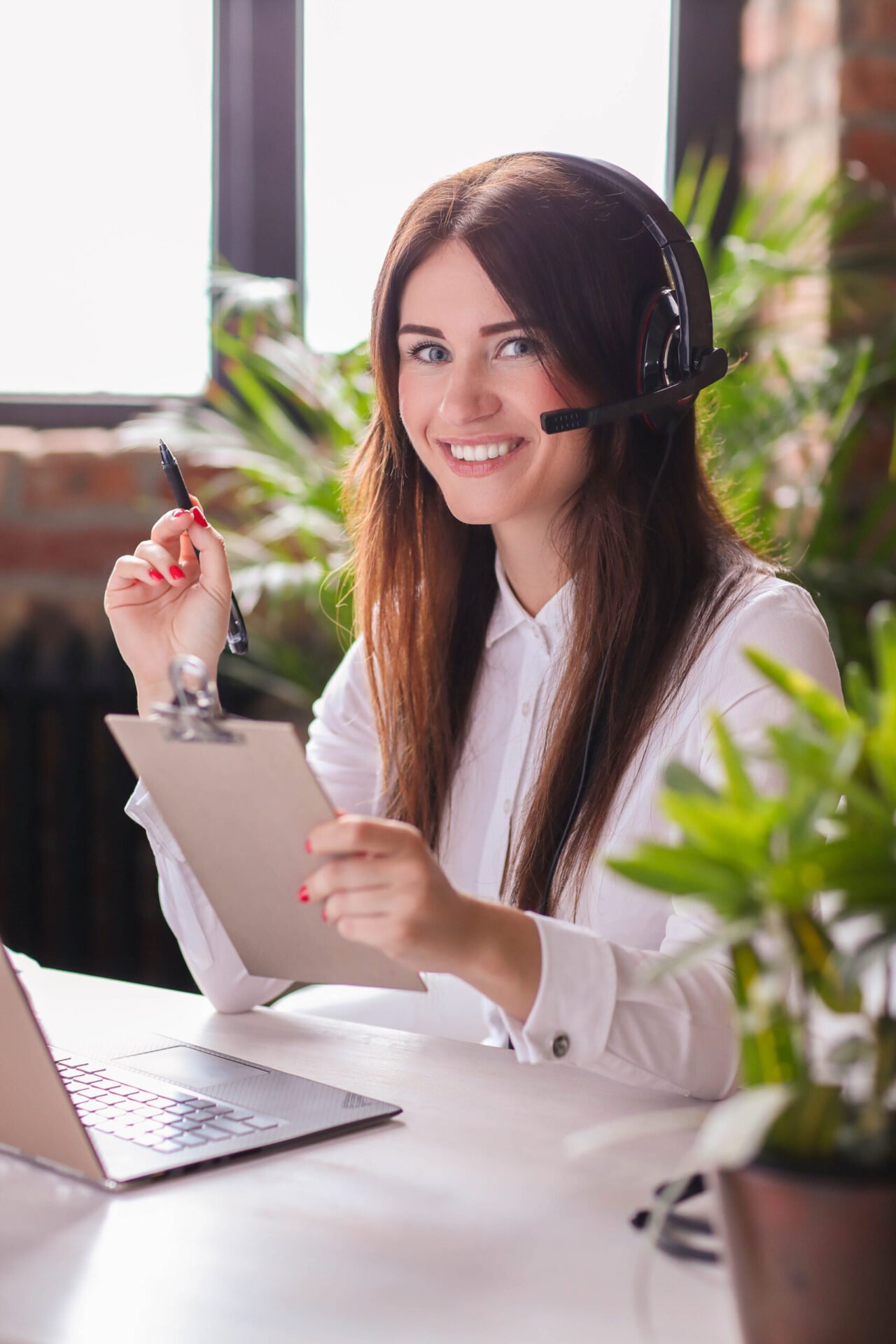 Woman working in call center as dispatcher